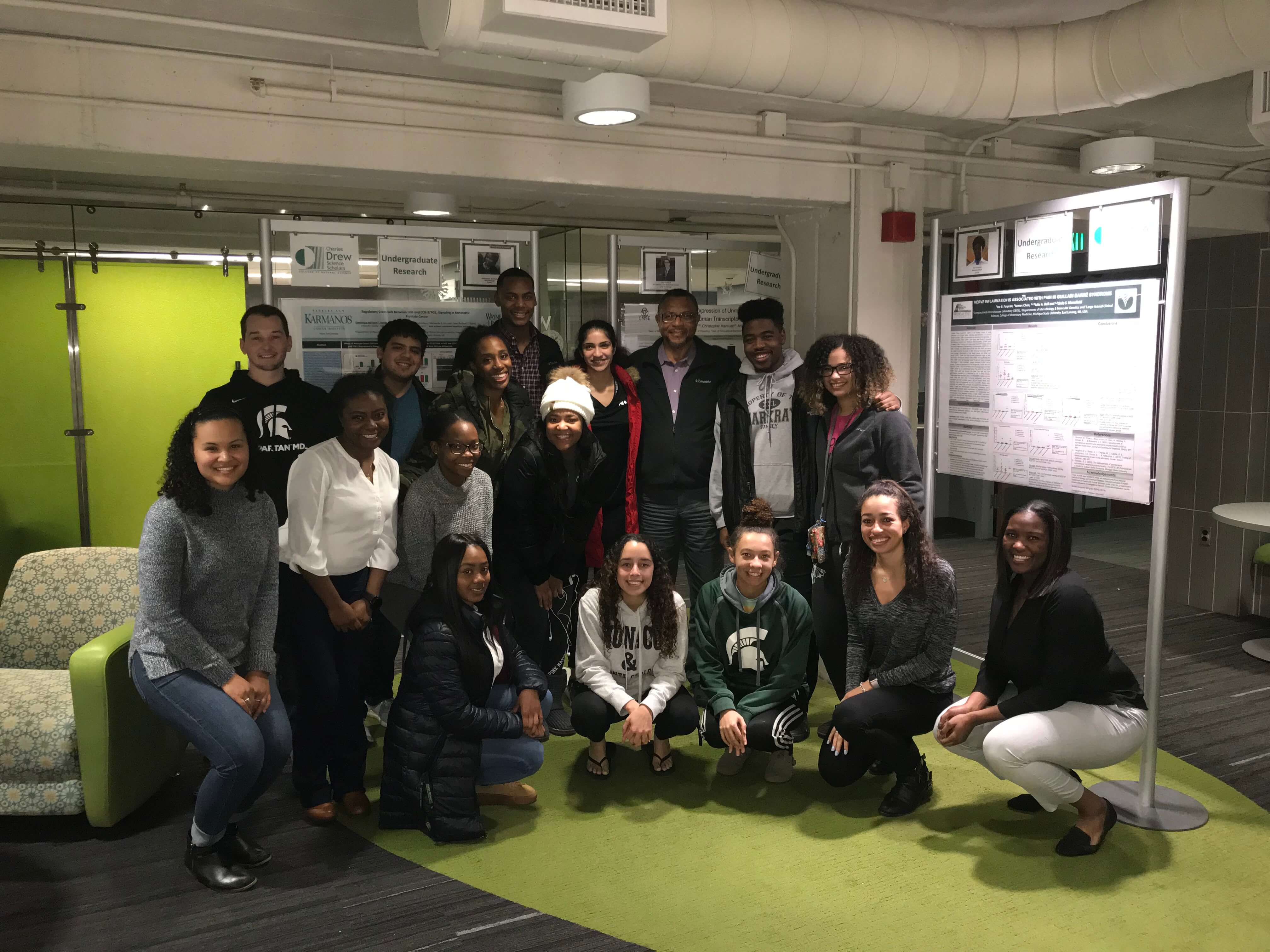 Drew scholar students in office posing for picture.