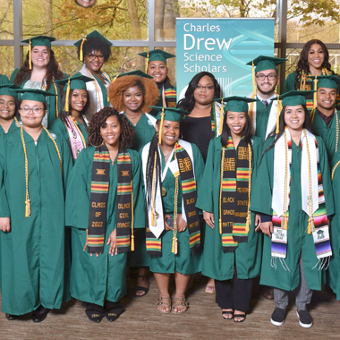 students in cap and gown at the 2023 dinner